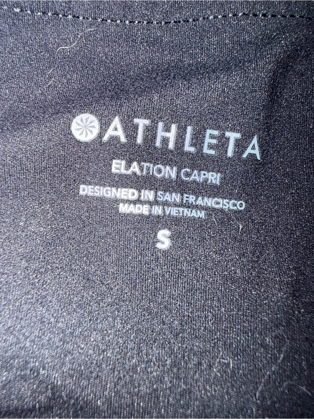 Athleta Black Elation Capri with Subtle Logo - Picture 2 of 3